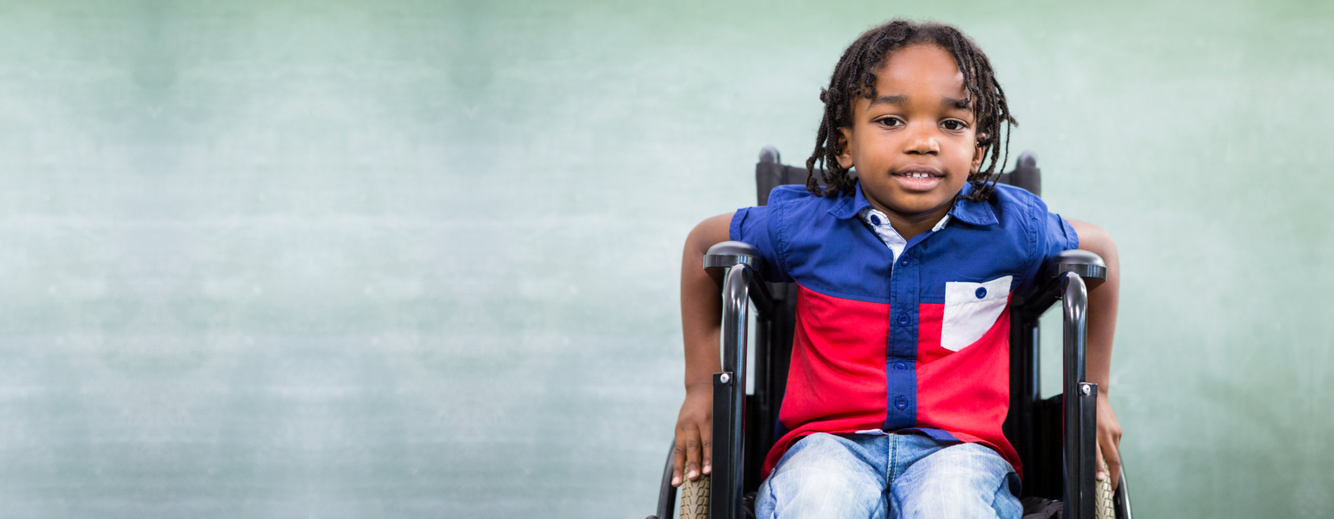 Portrait of handicapped boy in classroom